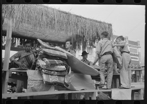 Untitled photo, possibly related to: Arranging prizes to be awarded at game concession, National Rice Festival, Crowley, Louisiana