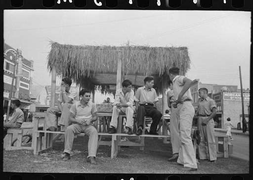 Untitled photo, possibly related to: Arranging prizes to be awarded at game concession, National Rice Festival, Crowley, Louisiana