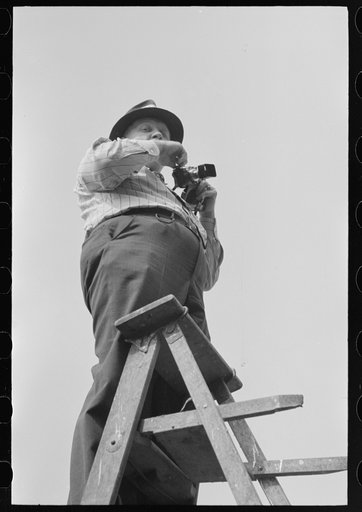 Photographer for local paper during National Rice Festival, Crowley, Louisiana