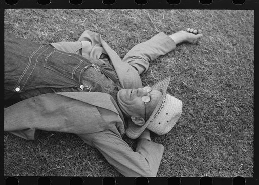 Farmer at National Rice Festival taking a rest, Crowley, Louisiana