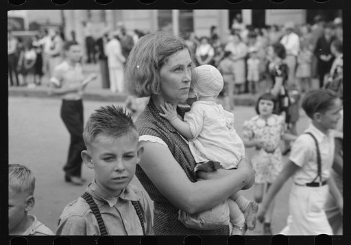 Farm mother with children in town during the National Rice Festival, Crowley, Louisiana