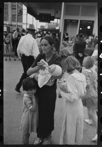 Farm mother with three children in town during the National Rice Festival, Crowley, Louisiana