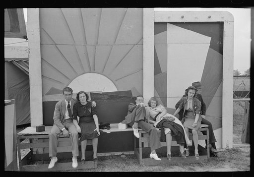 Group of tired people resting at state fair, Donaldsonville, Louisiana