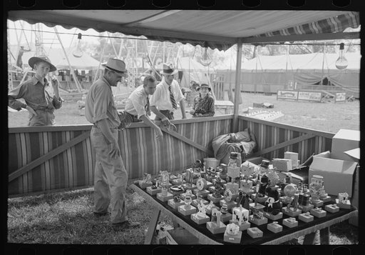 Tossing rings at objects in concessions, state fair, Donaldsonville, Louisiana