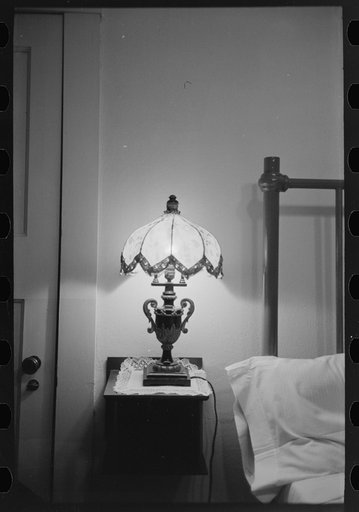 Bedroom with lamp in hotel at Donaldsonville, Louisiana