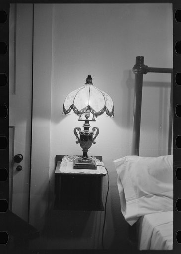 Untitled photo, possibly related to: Bedroom with lamp in hotel at Donaldsonville, Louisiana