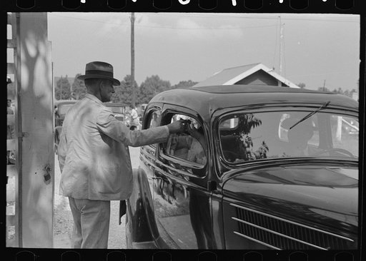 Ticket taker at gate, state fair, Donaldsonville, Louisiana