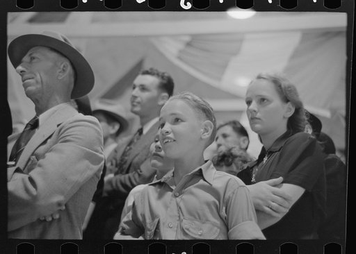 Group of people watching magician, state fair, Donaldsonville, Louisiana