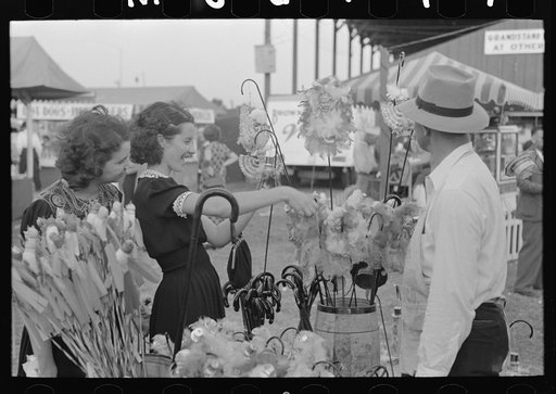 Girl buying cane from concessionaire, Donaldsonville, Louisiana, state fair