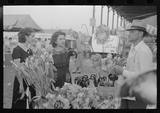Untitled photo, possibly related to: Girl buying cane from concessionaire, Donaldsonville, Louisiana, state fair