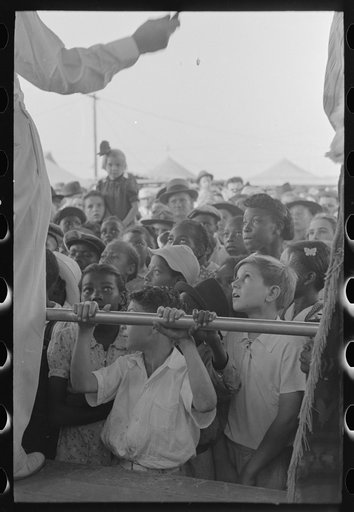 Untitled photo, possibly related to: Children listening to barker at sideshow, state fair, Donaldsonville, Louisiana