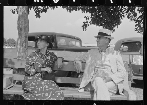 Untitled photo, possibly related to: Couple sitting on bench, state fair, Donaldsonville, Louisiana