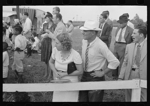 Untitled photo, possibly related to: Group of people watching ceremonies on main platform, state fair, Donaldsonville, Louisiana