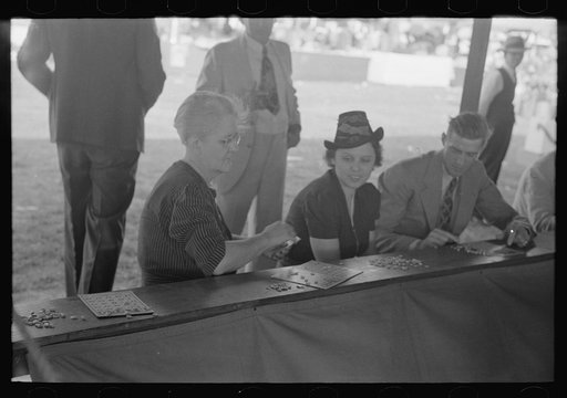 Untitled photo, possibly related to: Women playing bingo, a very popular game at state fair, Donaldsonville, Louisiana
