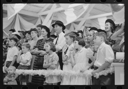Group of people watching magician, state fair, Donaldsonville, Louisiana