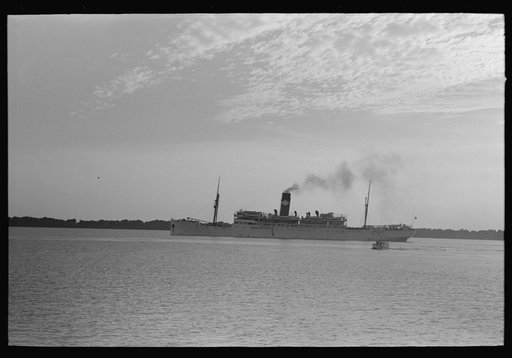 Untitled photo, possibly related to: Pilot stepping from pilot boat to dock, Pilottown, Louisiana