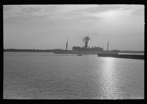 Untitled photo, possibly related to: Pilot stepping from pilot boat to dock, Pilottown, Louisiana