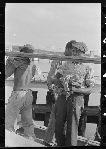 Untitled photo, possibly related to: Negro stevedores handling lumber in unloading process, unloading the "El Rito," Pilottown, Louisiana