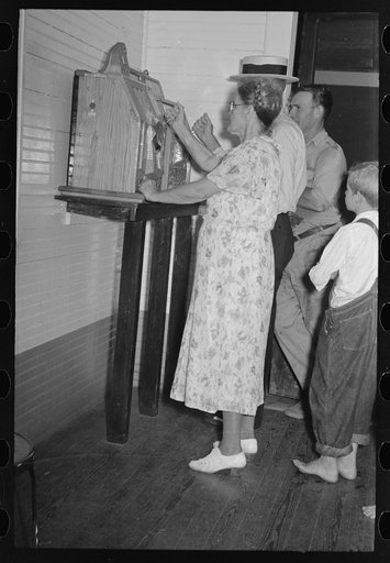 Untitled photo, possibly related to: People watching slot machine being played, Pilottown, Louisiana