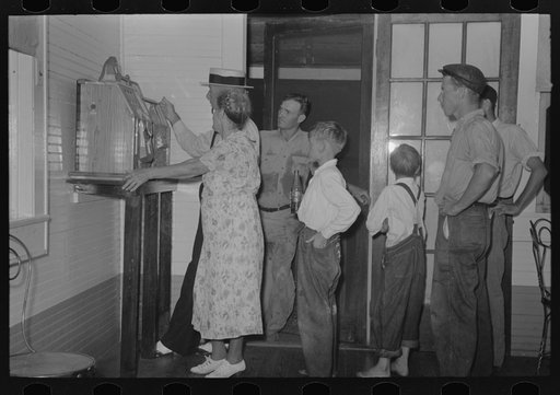People watching slot machine being played, Pilottown, Louisiana