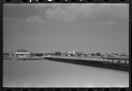 Untitled photo, possibly related to: Negro deck hand throwing line in docking operations, Burrwood, Louisiana