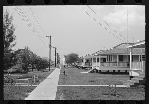 Row of cottages, Burrwood, Louisiana. This is chiefly a base for dredging operations of U.S. Engineering Corps