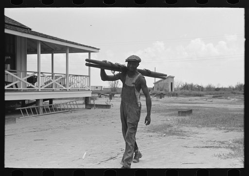 Untitled photo, possibly related to: Negro stevedore, with lumber on shoulder, New Orleans, Louisiana
