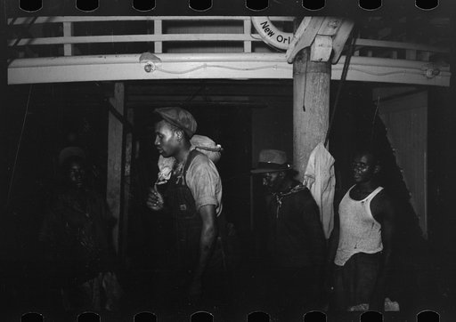 Untitled photo, possibly related to: Negro stevedores handling drum, New Orleans, Louisiana