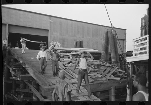 Untitled photo, possibly related to: Negro stevedore, with lumber on shoulder, New Orleans, Louisiana
