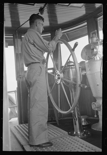 Captain of tugboat at the wheel, lower Mississippi River