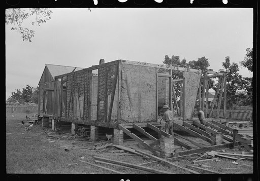 Untitled photo, possibly related to: Side wall of old house dating from early nineteenth century showing details of construction. Showing use of mud and moss as filling agent. Near Edgard, Louisiana