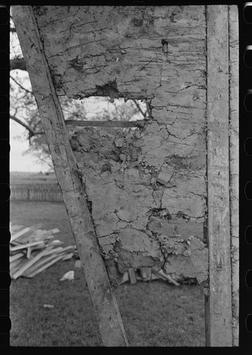 Untitled photo, possibly related to: Detail of construction of old house; note the wooden cross lath. The construction material composed of mud and native moss. Near Edgard, Louisiana
