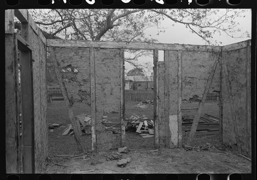Untitled photo, possibly related to: Side wall of old house dating from early nineteenth century showing details of construction. Showing use of mud and moss as filling agent. Near Edgard, Louisiana