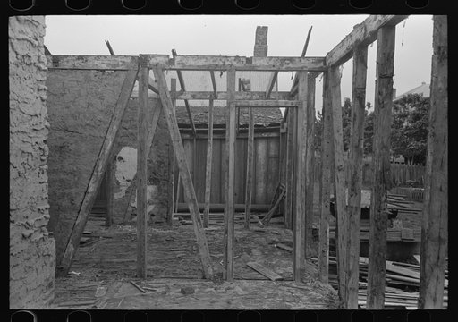 Side wall of old house dating from early nineteenth century showing details of construction. Showing use of mud and moss as filling agent. Near Edgard, Louisiana