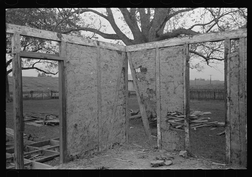 Side wall of old house dating from early nineteenth century showing details of construction. Showing use of mud and moss as filling agent. Near Edgard, Louisiana