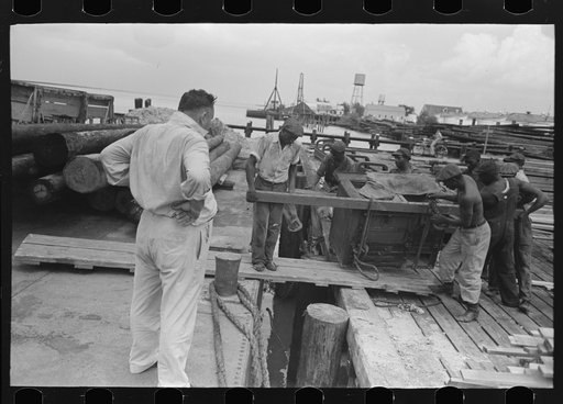 Negro stevedores loading stove onto packet boat under supervision of captain, Burrwood, Louisiana