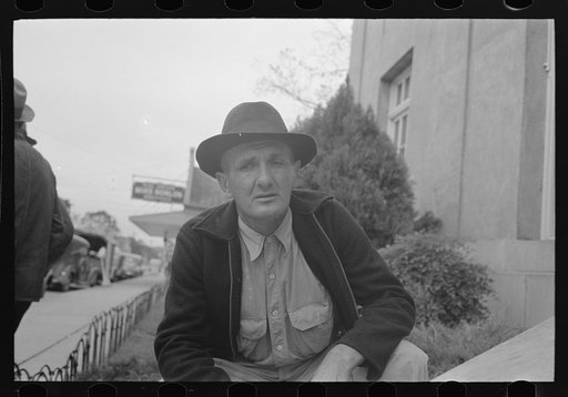 Man in front of post office, Lafayette, Louisiana