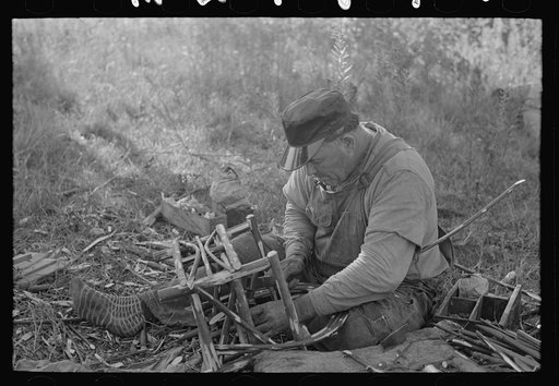 Migrant cane chair maker on U.S. 90 near Jeanerette, Louisiana