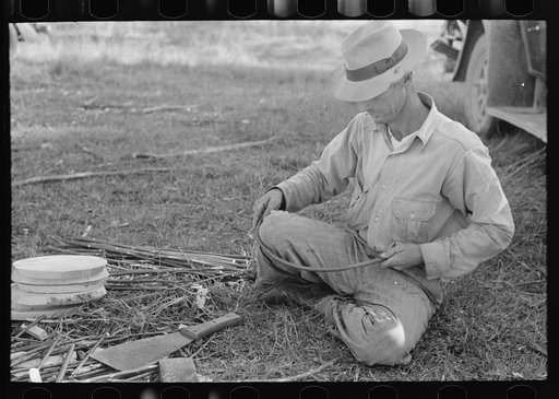 Migrant cane chair maker on U.S. 90 near Jeanerette, Louisiana
