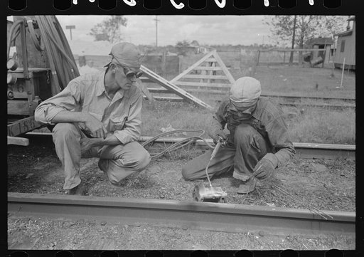 Untitled photo, possibly related to: Welding a rail near Port Barre, Louisiana