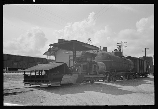 Untitled photo, possibly related to: Railroad weed burner being fueled, Port Barre, Louisiana