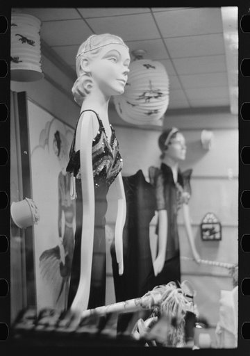 Dress model in store window, New Iberia, Louisiana