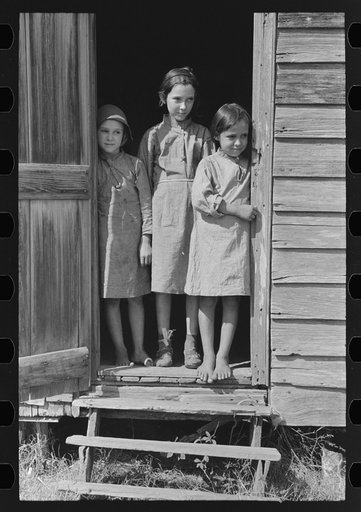 Children of day laborer in doorway of their home near New Iberia, Louisiana