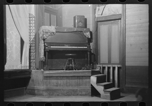 Piano on platform in auditorium, New Iberia, Louisiana