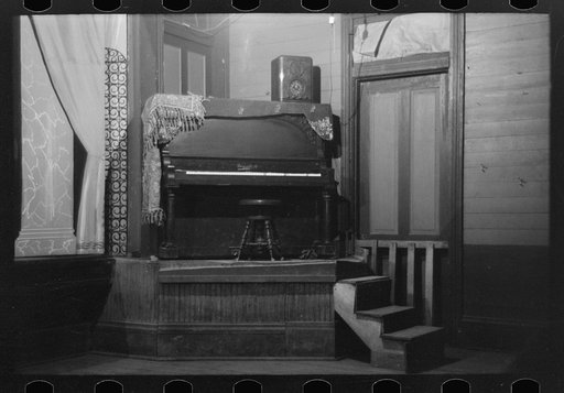 Untitled photo, possibly related to: Piano on platform in auditorium, New Iberia, Louisiana