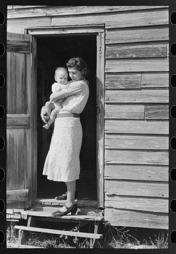 Wife and child of day laborers, sugarcane fields near New Iberia, Louisiana