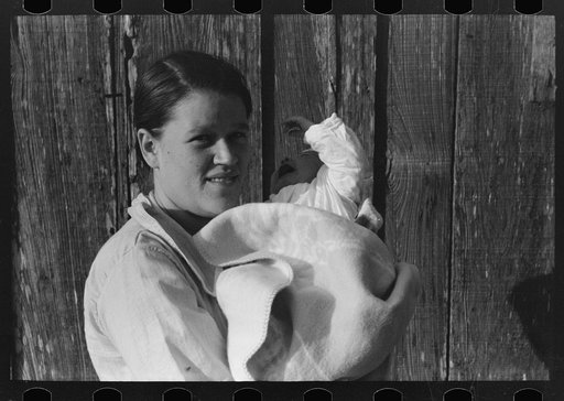 Untitled photo, possibly related to: Wife and child of day laborers, sugarcane fields near New Iberia, Louisiana