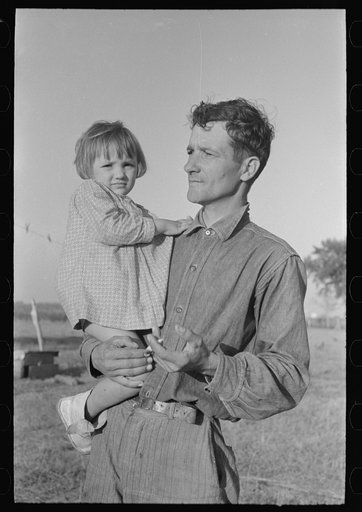 Cajun sugarcane farmer with daughter, near New Iberia, Louisiana