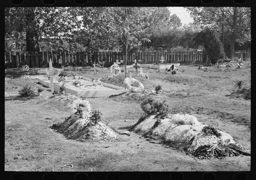 Decorated graves in cemetery on All Saints' Day at New Roads, Louisiana