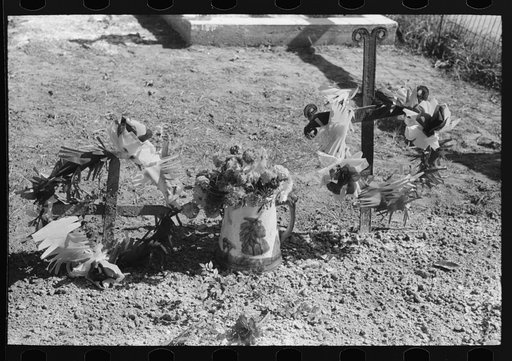 Untitled photo, possibly related to: Decorated graves in cemetery on All Saints' Day at New Roads, Louisiana